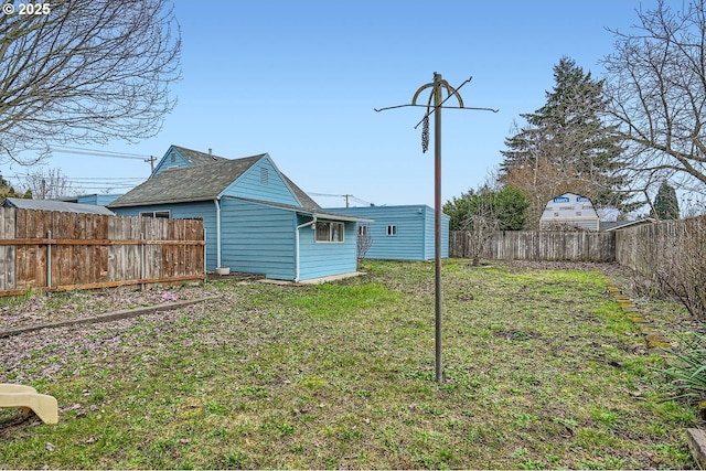 view of yard with a fenced backyard