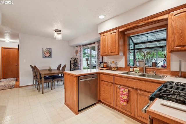 2235 SE 185th Ave, Portland, OR 97233 - kitchen with dishwasher, a peninsula, light countertops, and light flooring