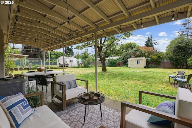 2235 SE 185th Ave, Portland, OR 97233 - fenced backyard featuring a shed, a patio, outdoor lounge area, and outdoor dining area