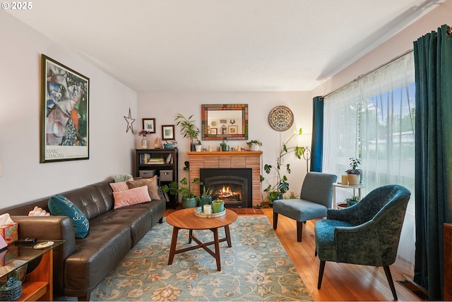 2235 SE 185th Ave, Portland, OR 97233 - living room featuring wood finished floors and a brick fireplace
