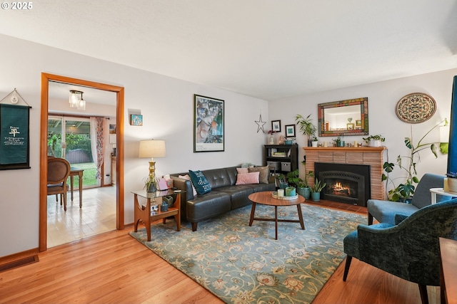 2235 SE 185th Ave, Portland, OR 97233 - living room featuring light wood-type flooring and a fireplace