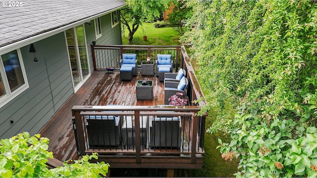 wooden deck featuring outdoor lounge area