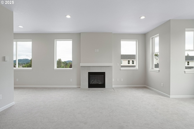 4636 SE 2nd St, Gresham, OR 97080 - unfurnished living room featuring carpet, a fireplace with flush hearth, and recessed lighting
