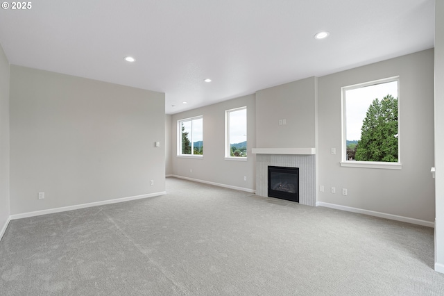 4636 SE 2nd St, Gresham, OR 97080 - unfurnished living room featuring carpet flooring, a tile fireplace, and recessed lighting