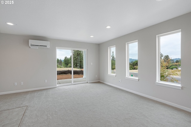 4636 SE 2nd St, Gresham, OR 97080 - empty room featuring a wall mounted AC, carpet floors, and recessed lighting