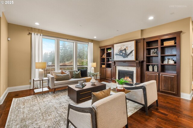 living room featuring dark hardwood / wood-style flooring and a fireplace