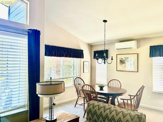 dining room featuring baseboards, a notable chandelier, light carpet, and a wall mounted AC