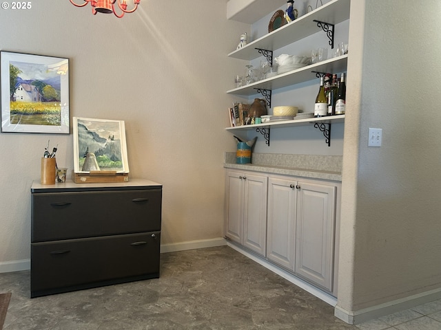 bar featuring baseboards