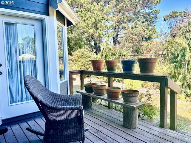 view of wooden balcony featuring a wooden deck