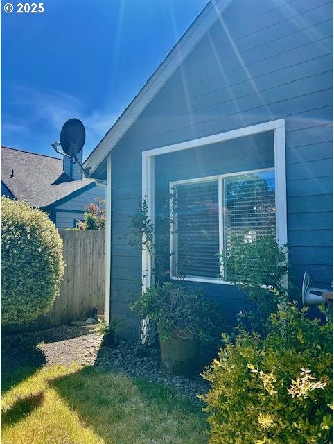 view of property exterior with fence