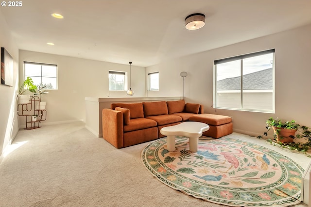 living area with carpet, baseboards, and recessed lighting