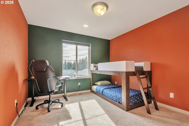 bedroom featuring carpet and baseboards