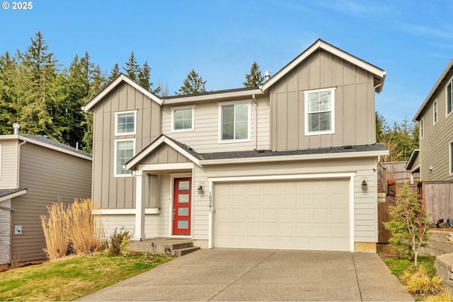 view of front of house featuring concrete driveway, board and batten siding, an attached garage, and fence