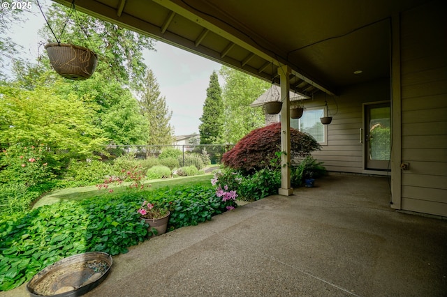 view of patio featuring fence