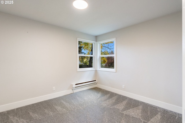 empty room with a baseboard radiator and carpet