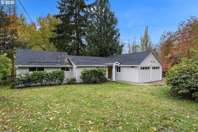 view of front facade featuring a garage and a front lawn