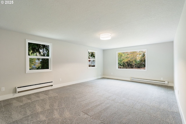 carpeted empty room featuring a baseboard radiator and a textured ceiling