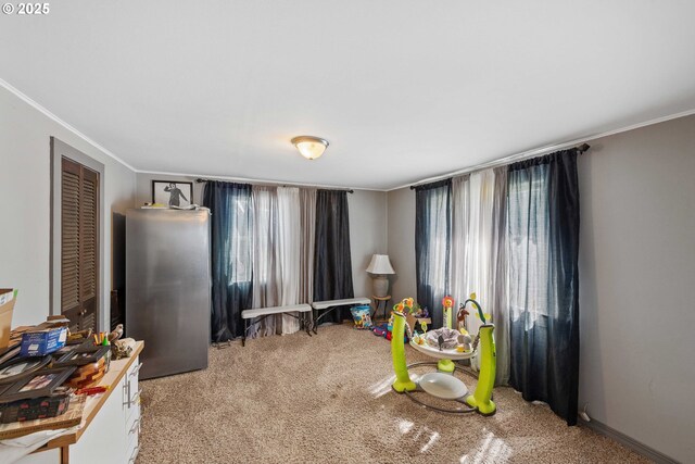 game room with light colored carpet and crown molding
