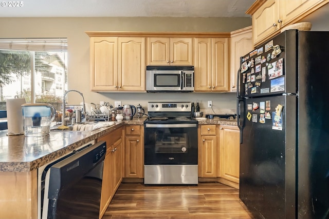 2833 NE Stapleton Rd, Vancouver, WA 98661 - kitchen featuring black appliances, a sink, light brown cabinetry, and wood finished floors