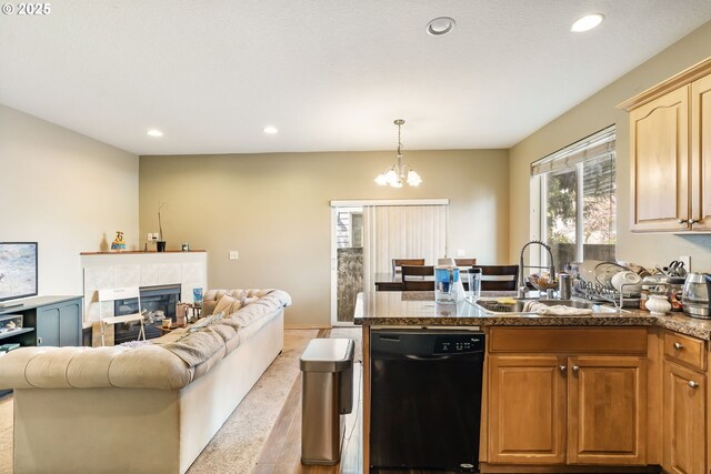 2833 NE Stapleton Rd, Vancouver, WA 98661 - kitchen featuring dishwasher, a sink, a peninsula, a chandelier, and open floor plan