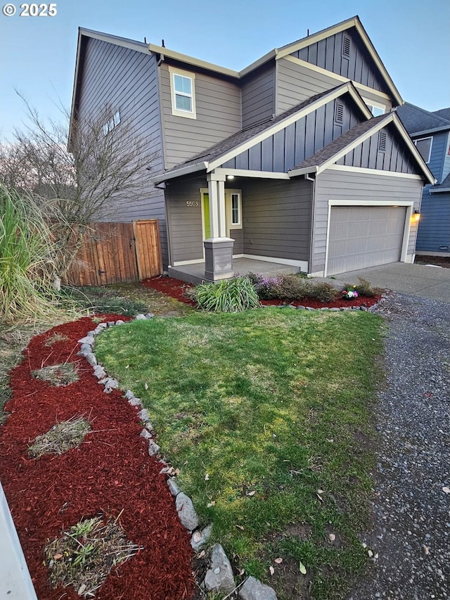 5503 NE 53rd Cir, Vancouver, WA 98661 - view of front of home with board and batten siding, a garage, asphalt driveway, and covered porch