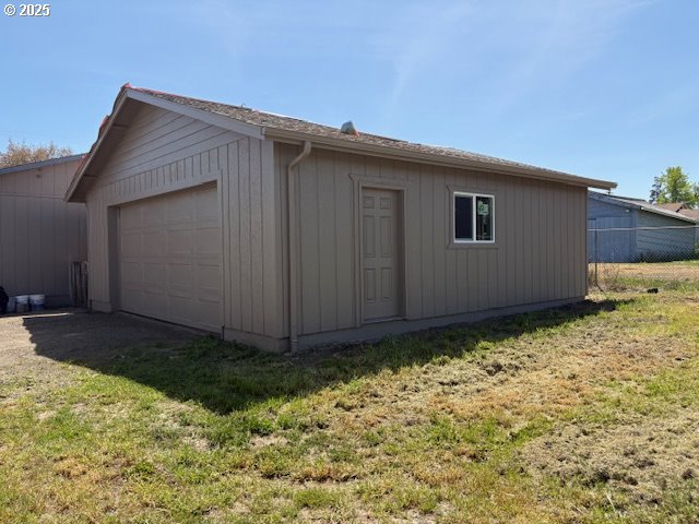 detached garage with fence