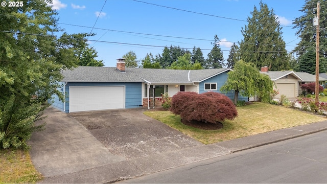 1897 Chelan St, Keizer, OR 97303 - single story home with an attached garage, a chimney, driveway, a front lawn, and a shingled roof