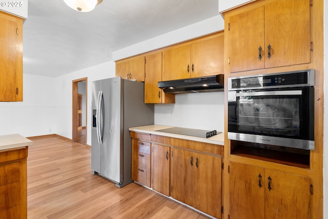 1897 Chelan St, Keizer, OR 97303 - kitchen featuring oven, under cabinet range hood, black electric cooktop, stainless steel refrigerator with ice dispenser, and light wood-style floors