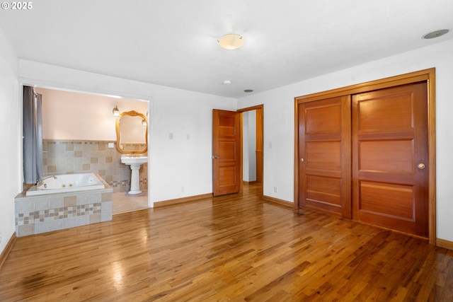 1897 Chelan St, Keizer, OR 97303 - unfurnished bedroom with light wood-style floors, a closet, and baseboards