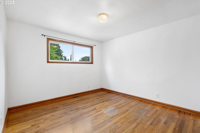 1897 Chelan St, Keizer, OR 97303 - empty room featuring light wood-style flooring and baseboards
