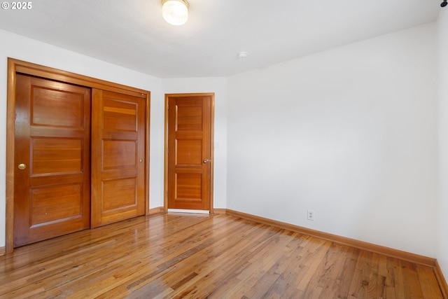 1897 Chelan St, Keizer, OR 97303 - unfurnished bedroom with baseboards, light wood finished floors, and a closet
