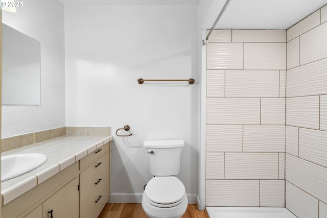 1897 Chelan St, Keizer, OR 97303 - bathroom featuring vanity, a shower, wood finished floors, toilet, and baseboards
