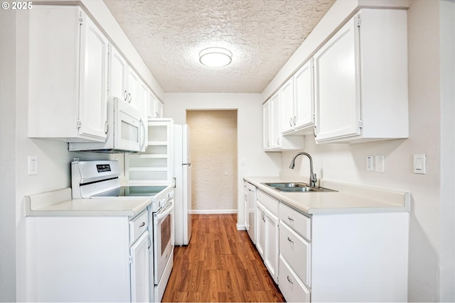 2380 NE Rene Ave, Gresham, OR 97030 - kitchen with white appliances, wood finished floors, light countertops, a textured ceiling, and white cabinetry