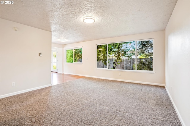 2380 NE Rene Ave, Gresham, OR 97030 - carpeted empty room featuring a textured ceiling and a smoke detector