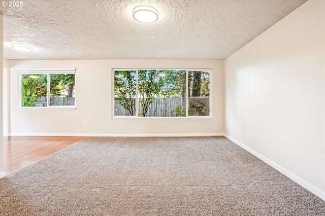 2380 NE Rene Ave, Gresham, OR 97030 - carpeted spare room with a textured ceiling and baseboards