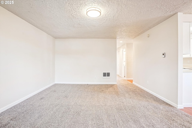 2380 NE Rene Ave, Gresham, OR 97030 - carpeted empty room featuring a textured ceiling and baseboards