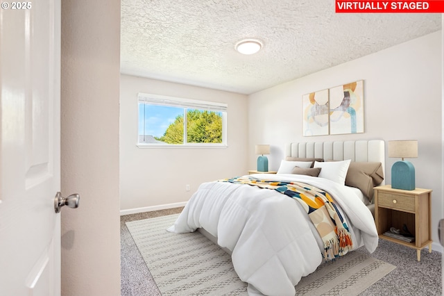 2380 NE Rene Ave, Gresham, OR 97030 - carpeted bedroom featuring a textured ceiling and baseboards