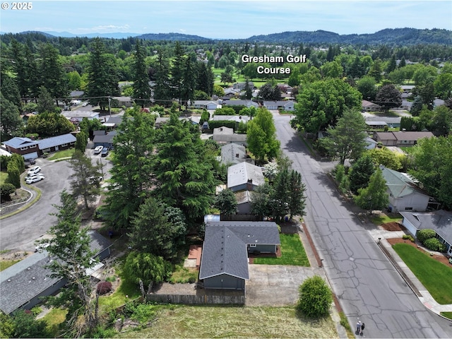 2380 NE Rene Ave, Gresham, OR 97030 - aerial perspective of suburban area featuring a mountain backdrop and a heavily wooded area