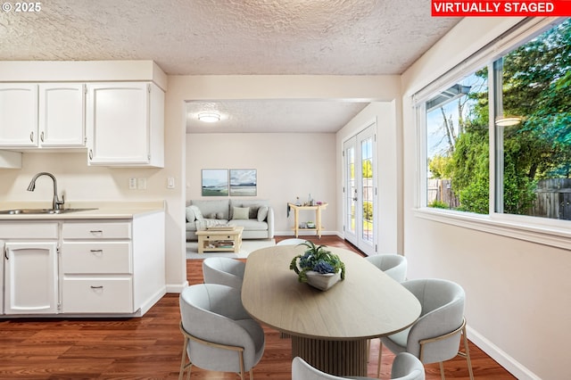 2380 NE Rene Ave, Gresham, OR 97030 - dining space with a textured ceiling and dark wood-style floors