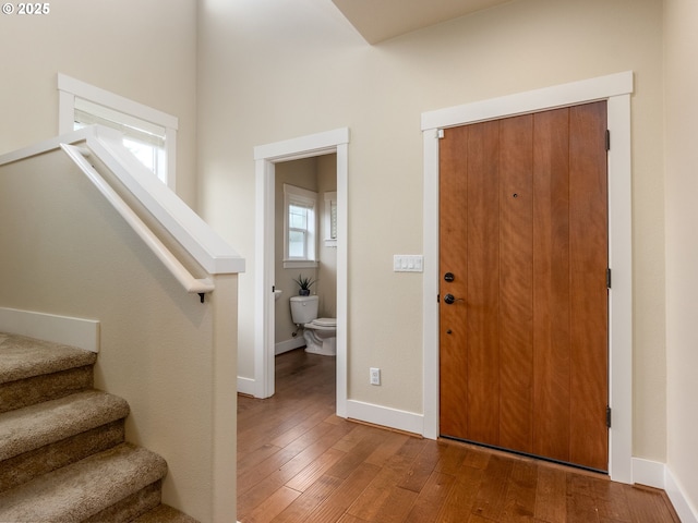 14420 SW Equestrian Ln, Beaverton, OR 97008 - foyer featuring wood-type flooring, stairs, and baseboards