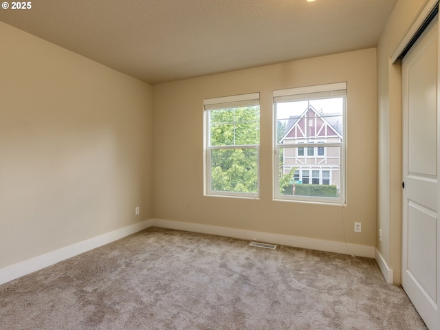 14420 SW Equestrian Ln, Beaverton, OR 97008 - carpeted spare room featuring baseboards