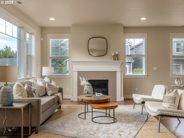 14420 SW Equestrian Ln, Beaverton, OR 97008 - living area with plenty of natural light, wood finished floors, recessed lighting, and a fireplace