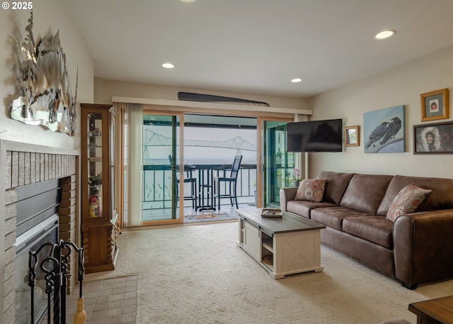 1 3rd St, Astoria, OR 97103 - living room featuring recessed lighting, light colored carpet, and a brick fireplace
