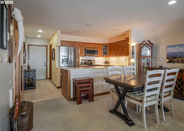 1 3rd St, Astoria, OR 97103 - dining space with light colored carpet, recessed lighting, and light tile patterned flooring