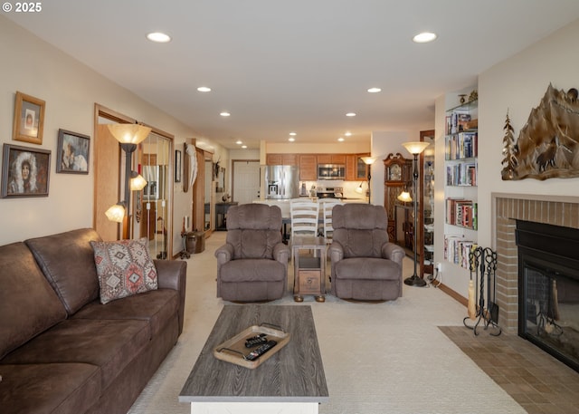 1 3rd St, Astoria, OR 97103 - living area with light carpet, recessed lighting, and a brick fireplace