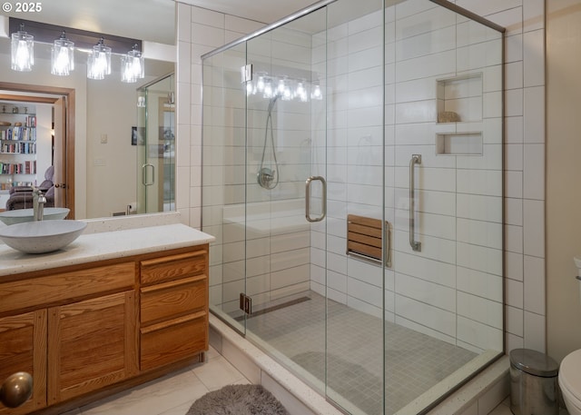 1 3rd St, Astoria, OR 97103 - full bath featuring vanity, a stall shower, and tile patterned flooring