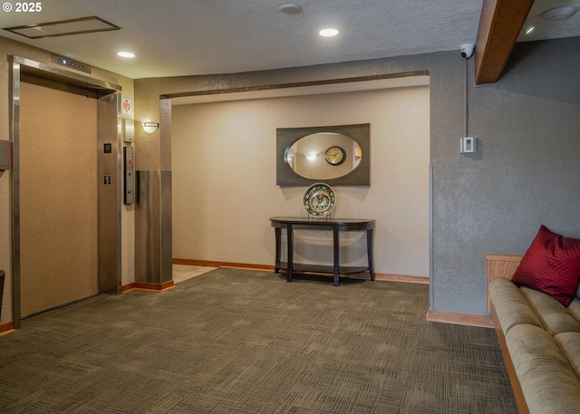 1 3rd St, Astoria, OR 97103 - corridor featuring elevator, carpet flooring, a textured wall, and recessed lighting