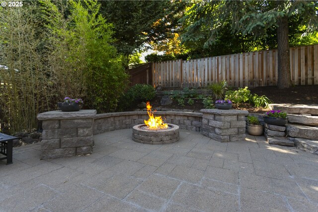 12453 SW Sheldrake Way, Beaverton, OR 97007 - view of patio with an outdoor fire pit
