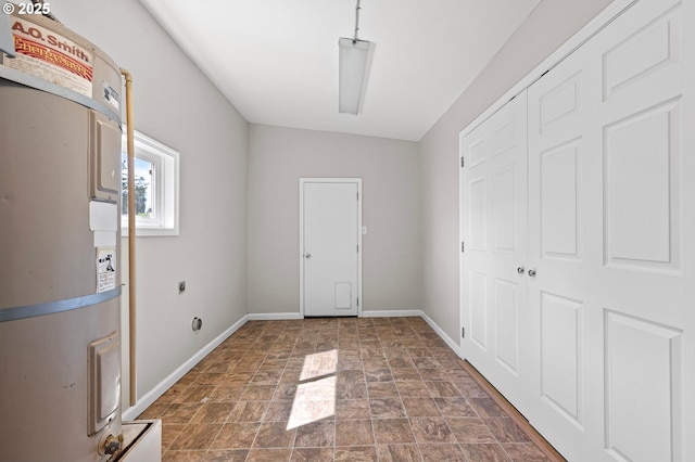 32791 E Lincoln Way, Coburg, OR 97408 - foyer entrance with water heater, stone finish floors, and baseboards
