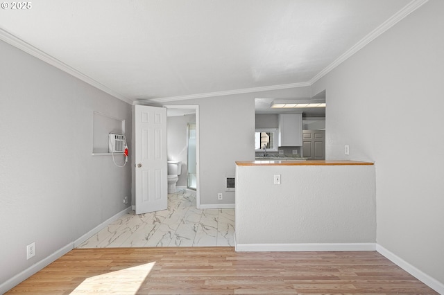 32791 E Lincoln Way, Coburg, OR 97408 - kitchen with crown molding, baseboards, a wall mounted air conditioner, and wood finished floors